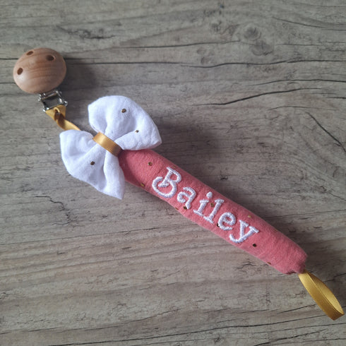 Attache tétine nœud personnalisée – Tube moelleux façon doudou avec prénom brodé - en gaze de coton pois or